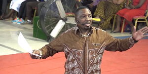 A photo of Pastor James Ng'ang'a of Neno Evangelism delivering a past sermon at the church.
