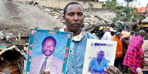 Patrick Karomo’s brother Fredrick Kamau holds the photos of their parents who died when an adjacent building collapsed on their house in Ruaka on Thursday, November 17, 2022