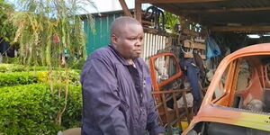 Aircraft maintenance worker at Wilson Airport, Paul Mbugua speaks outside his own garage based in Kiambu County.