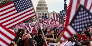 People holding United States flags