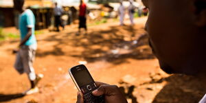 Image of unidentified man using a phone