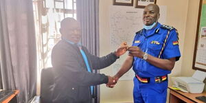 Police AIG Thomas Kabute (right) takes over s the new Airwing Commandant from Col. (Rtd) Rogerd Mbithi.