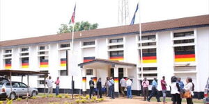 Police officers and citizens pictured outside Kasarani Police Station, Nairobi County on May 18, 2020.