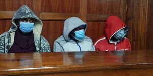 Police officers Phillip Mbithi, Kamakia Mutuma and Precious Mwende at a Milimani court on October 15, 2021.