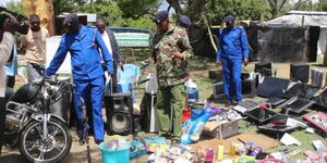 Police scan through part of the stolen goods recovered in Naivasha on Tuesday, December 13, 2022..jpg