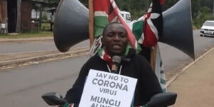 A photo of Polycarp Wafula riding his famous bike mounted with a public address system for coronavirus sensitization in Bungoma.