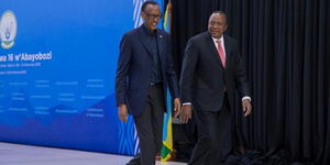 Rwandan President Paul Kagame walks alongside President Uhuru Kenyatta during the Umwiherero Conference in Kigali, Rwanda on March 11, 2019