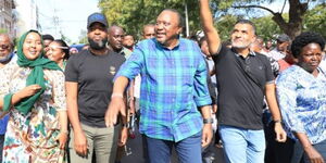 Former President Uhuru Kenyatta (centre) walking in Mombasa in the company of Mombasa governor Abdulswamad Nasir, former governor Hassan Joho and other leaders from coast on Thursday,