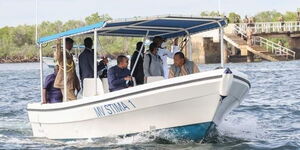 President Uhuru Kenyatta (front left) talks to Ethiopian Prime Minister Abiy Ahmed during a boat ride in Mombasa in Decemeber 2020