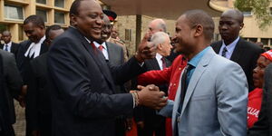 President Uhuru Kenyatta (left) greets Embakasi East MP Babu Owino during their past meeting