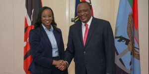 President Uhuru Kenyatta (right) greets State House Spokesperson Kanze Dena at State House in June 2018