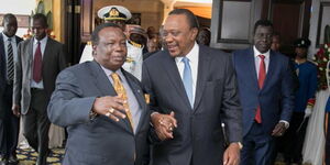 President Uhuru Kenyatta (right) speaks to COTU SG Francis Atwoli