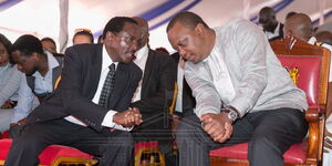 President Uhuru Kenyatta (right) with Wiper leader kalonzo Musyoka during Musyoka's father's funeral in Mwingi on November 9, 2018.