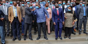 President Uhuru Kenyatta and Amos Kimunya share a light moment after Jubilee's PG meeting on June 22, 2020