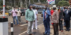 President Uhuru Kenyatta (in green shirt) and former Prime Minister Raila Odinga (in a brown shirt) at Green Park Terminus on Thursday, April 1, 2021.