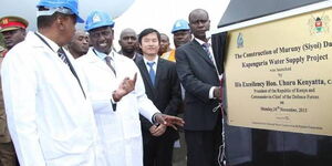 President Uhuru Kenyatta and his deputy William Ruto (both in lab coats) launch Muruny-Siyoi Water Dam project in 2015