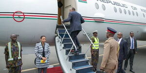 President Uhuru Kenyatta boarding a plane