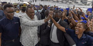 President Uhuru Kenyatta greets MAS Intimates workers in Athi River on Wednesday, May 11, 2022.