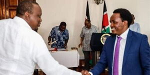 President Uhuru Kenyatta greets Zachary Kinuthia during his appointment as Chief Administrative Secretary (CAS) in the Ministry of Education on January 14, 2020. 