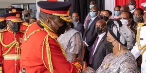 President Uhuru Kenyatta greets first lady Margaret Kenyatta during the Jamhuri Day Celebrations at Uhuru Gardens on December 12