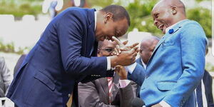 President Uhuru Kenyatta shares a light moment with Milele FM Presenter Jalang'o.