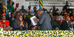 President Uhuru Kenyatta with Tanzania's President Samia Suluhu during the state funeral of the late President Pombe Magufuli on March 22, 2021