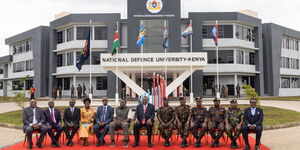 President Uhuru Kenyatta with other government officials at the National Defence University in Lanet