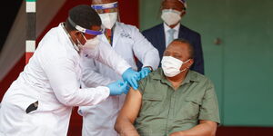 President Uhuru Kenyatta receiving Covid-19 vaccine on March 26, 2021 at State House, Nairobi.