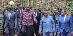 President William Ruto (left), his predecessor Uhuru Kenyatta entertain other leaders in Nairobi on Monday, November 28, 2022.
