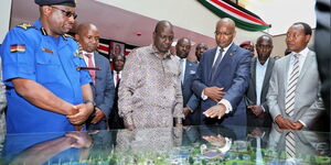 President William Ruto (third left) and other leaders look at the artistic impression of the newly-launched National Police Academy on Wednesday, December 21, 2022.