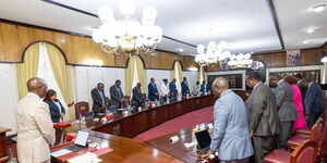 President William Ruto and CSs praying during a cabinet meeting at State House on Monday, November 27, 2023