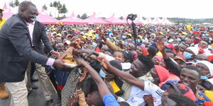 President William Ruto interacts with Kenyans during campaigns.