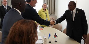 President of the World Health Organisation David Malpass greets President Uhuru Kenyatta during a meeting at the United Nations General Assembly on September 25, 2019.