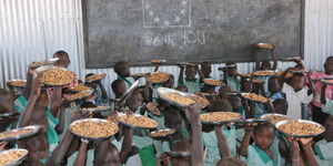 Kenya pupils eating after a feeding program was started. 