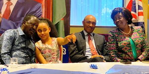 Former Prime Minister engaging with Natasha Macharia during an engagement forum in the UK on March 17, 2022.