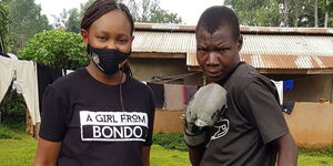 Caroll Radull (left) pictured with iconic boxer Conjestina Achieng' in Siaya County