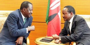 Former Prime Minister Raila Odinga speaking to Wiper leader Kalonzo Musyoka at a past event.