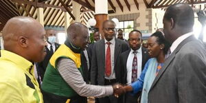 President Willian Ruto greeting Martha Karua as former Prime Minister Raila Odinga and Interior Cabinet Secretary Kithure Kindiki look on at an IEBC event on June 19, 2022.