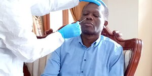 Raphael Tuju undergoes Covid 19 testing in his house on March 26, 2020.