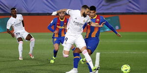An undated photo of a past match between Barcelona and Real Madrid.