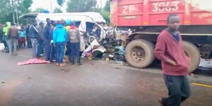 Rescuers attempt to save people trapped in a matatu along Kitale-Webuye Road