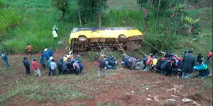 Residents attempt to save an overturned School Bus along Meru-Nairobi Highway in Tharaka Nithi.