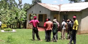 Residents in Kamukuywa village in the home of the man who returned home after being presumed dead