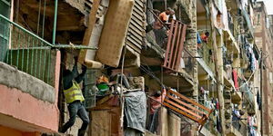 Residents move sofas and beds from a block of flats in Nairobi.