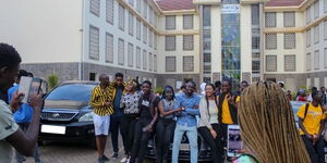 Students pose for a photo at Riara University. 