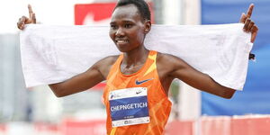 Ruth Chepngetich celebrates winning the 2021 Bank of America Chicago Marathon title on October 10.
