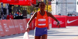 Ruth Chepngetich crosses the finishing line at the 2022 Bank of America Chicago Marathon on October 9.