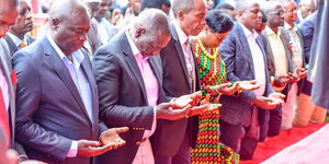 President William Ruto and Deputy President Rigathi Gachagua kneel down for prayers during a church service in  Kiambu County on August 21, 2022. 