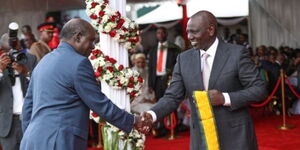 President William Ruto honouring former IEBC Chairperson Wafula Chebukati during the Jamhuri Day celebrations on Monday December 12, 2022