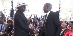 President William Ruto (right) welcomes Azimio La Umoja party leader, Raila Odinga, at Mukami Kimathi funeral in Nyandarua on Saturday, May 13, 2023